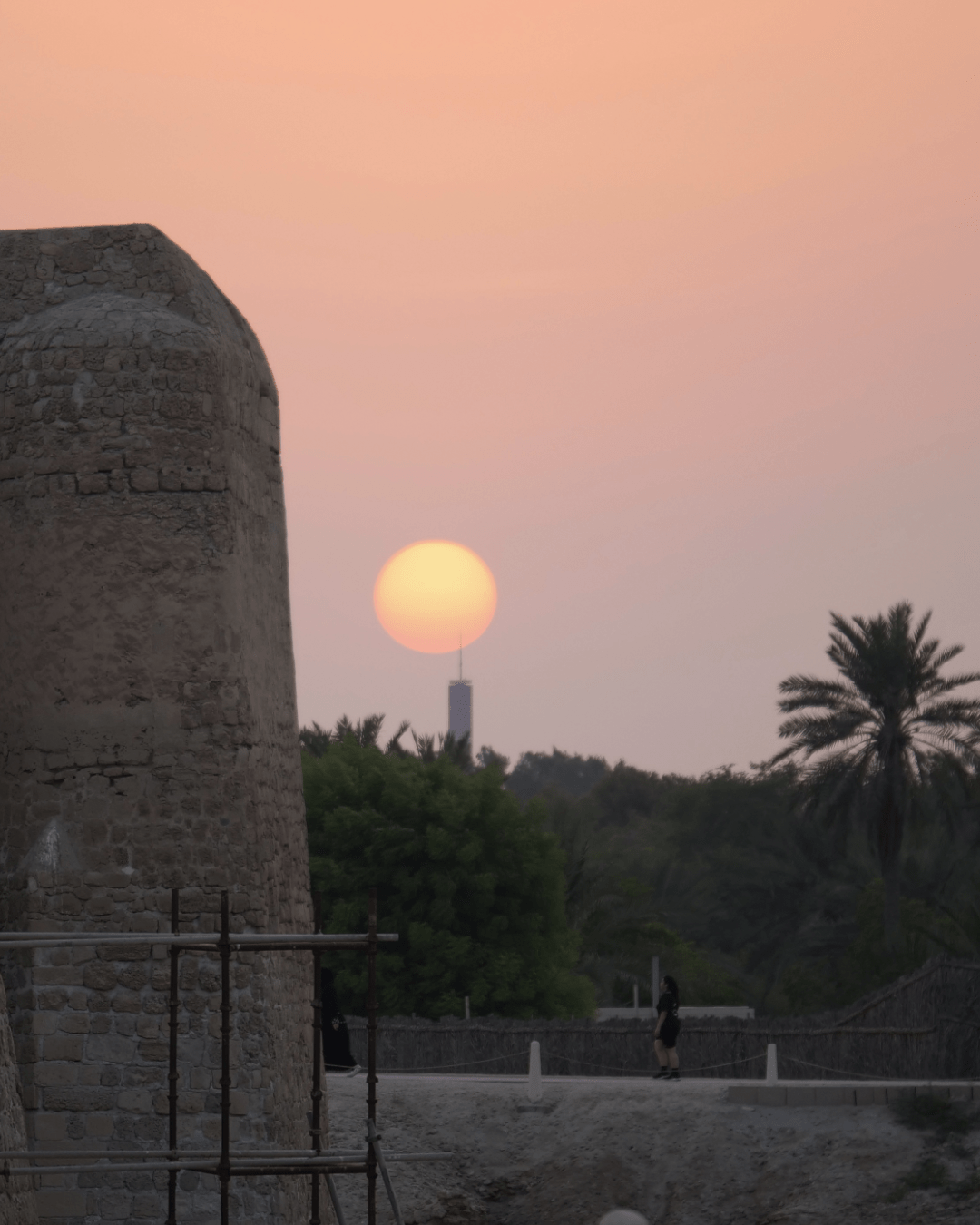 Sunset with a beautiful golden sun and a the fort on the right side