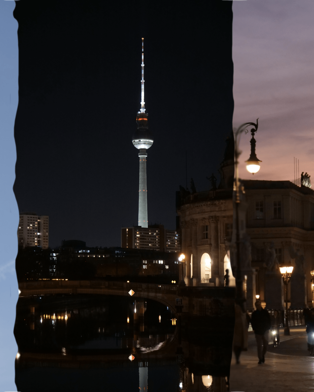fernsehenturm at night with it's reflection in calm water