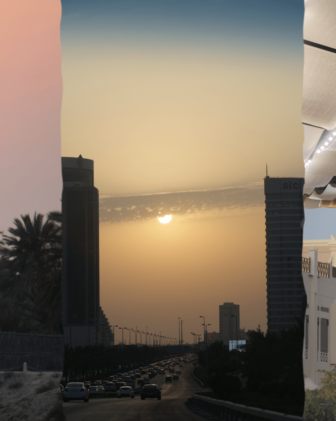 Sunset with a beautiful golden sun over a road and a silhouettes of skyscrapers at both sides